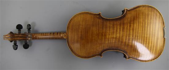 A violin bearing label for Maggini and date 1616, 14.5in., length overall 23.5in.